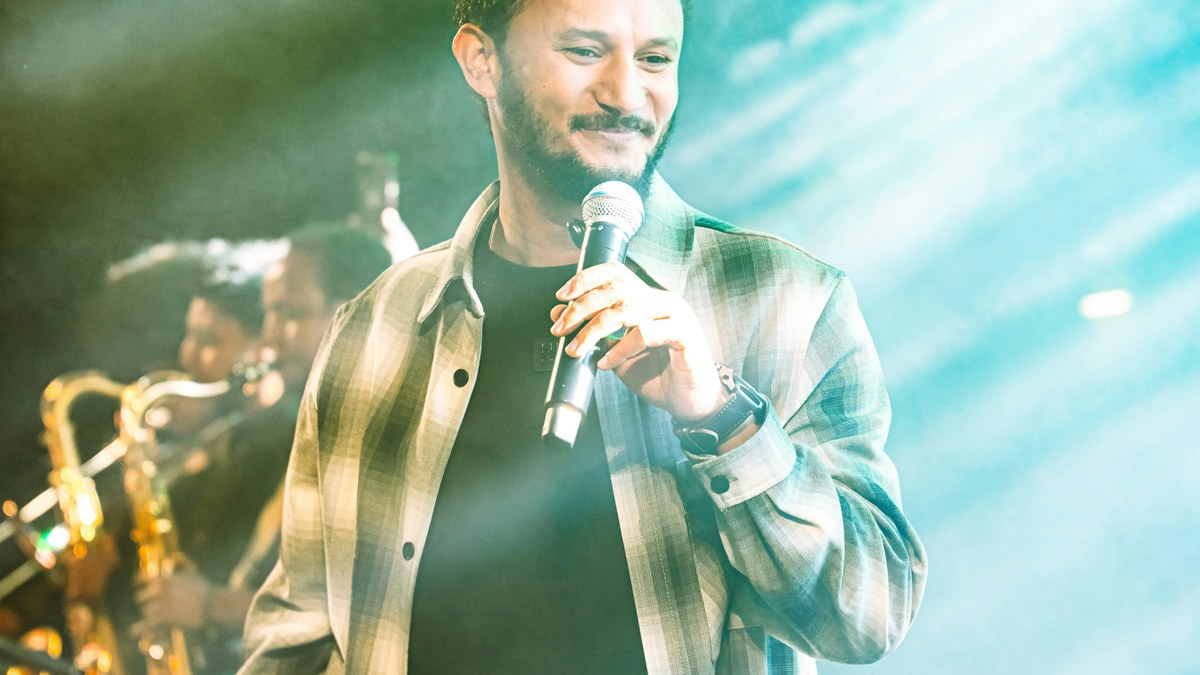 Performer with a microphone on stage
