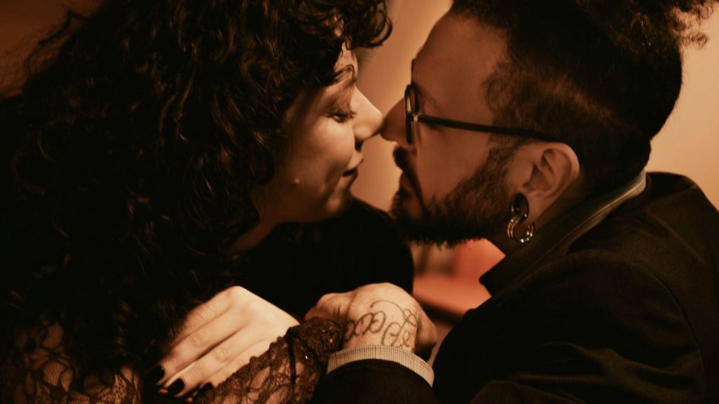 Couple embracing closely on a date night