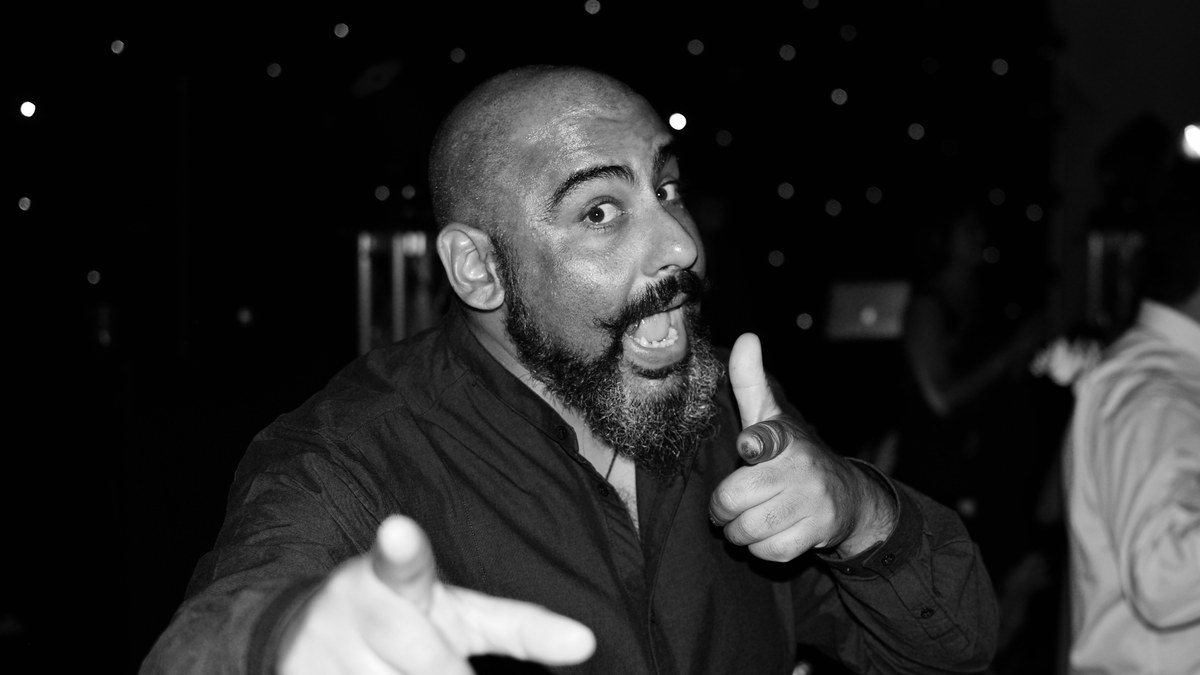 Comedian pointing at the camera